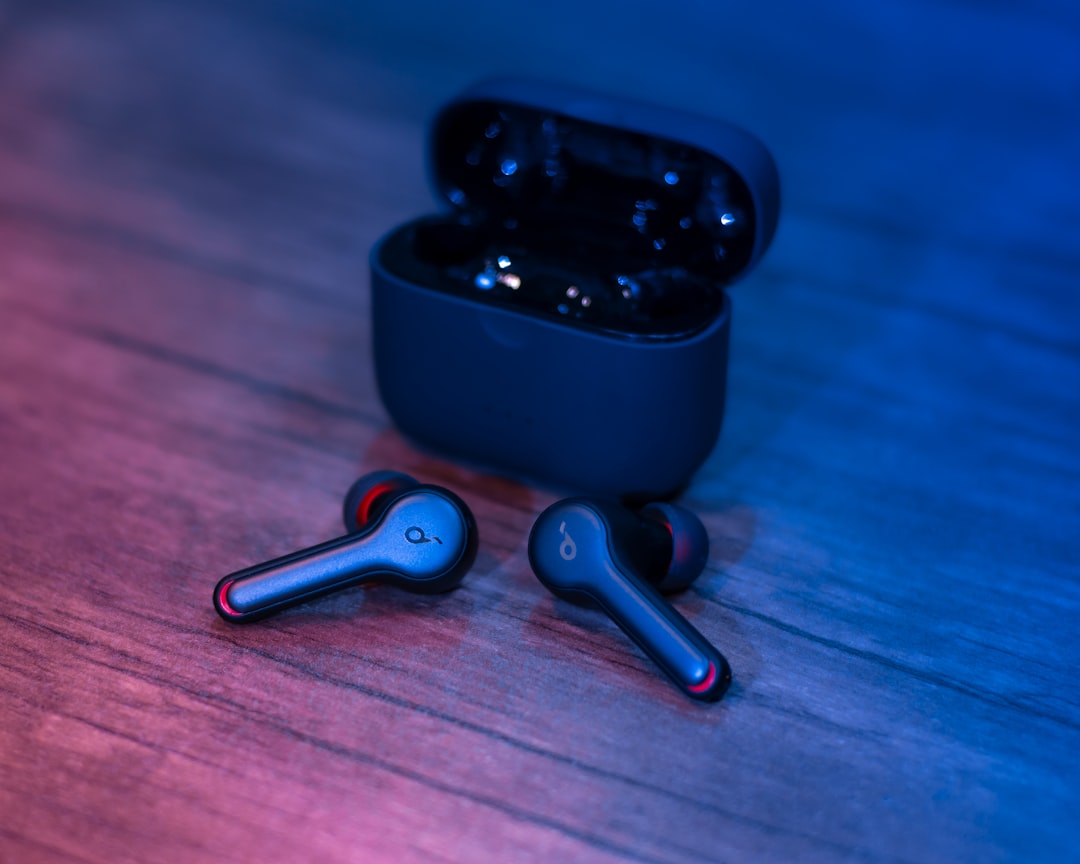 black-and-silver-bluetooth-earbuds-oxabqjuoloa